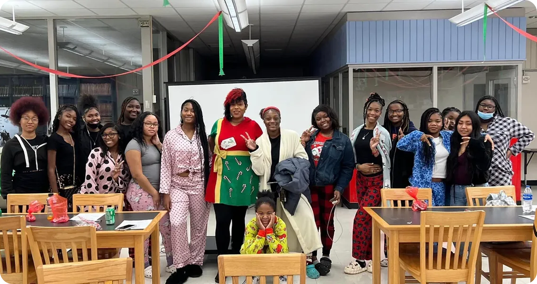 Diverse group wearing pajamas in classroom