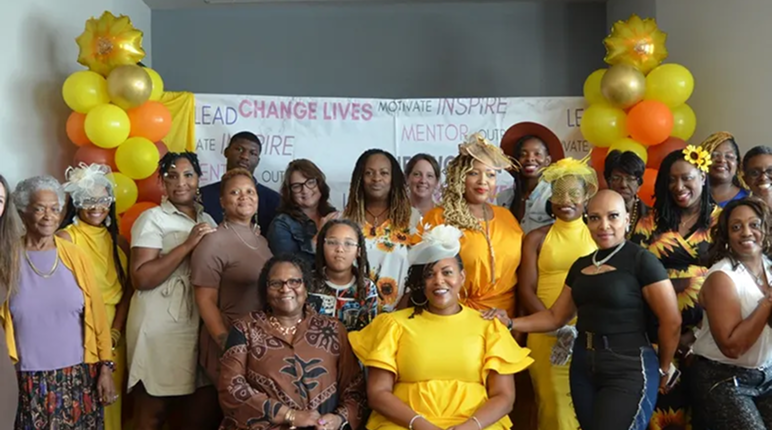 Diverse women posing with balloons